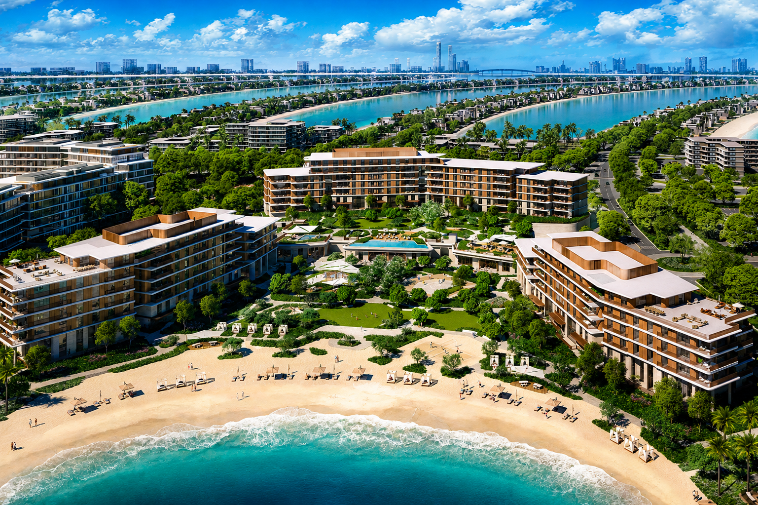A high-resolution aerial view of a luxury beachfront residential and resort development surrounded by lush landscaping and turquoise waterways. Several modern mid-rise buildings frame a private sandy beach and landscaped central courtyard with pools, pathways, and recreational areas. In the background, palm-shaped island fronds extend into the sea, with rows of waterfront villas and a distant city skyline visible under a bright blue sky with scatte